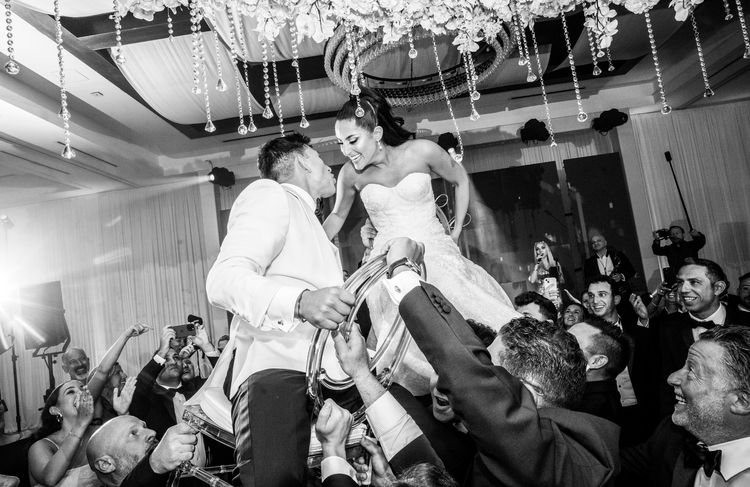 black and white photo of bride and groom during wedding reception