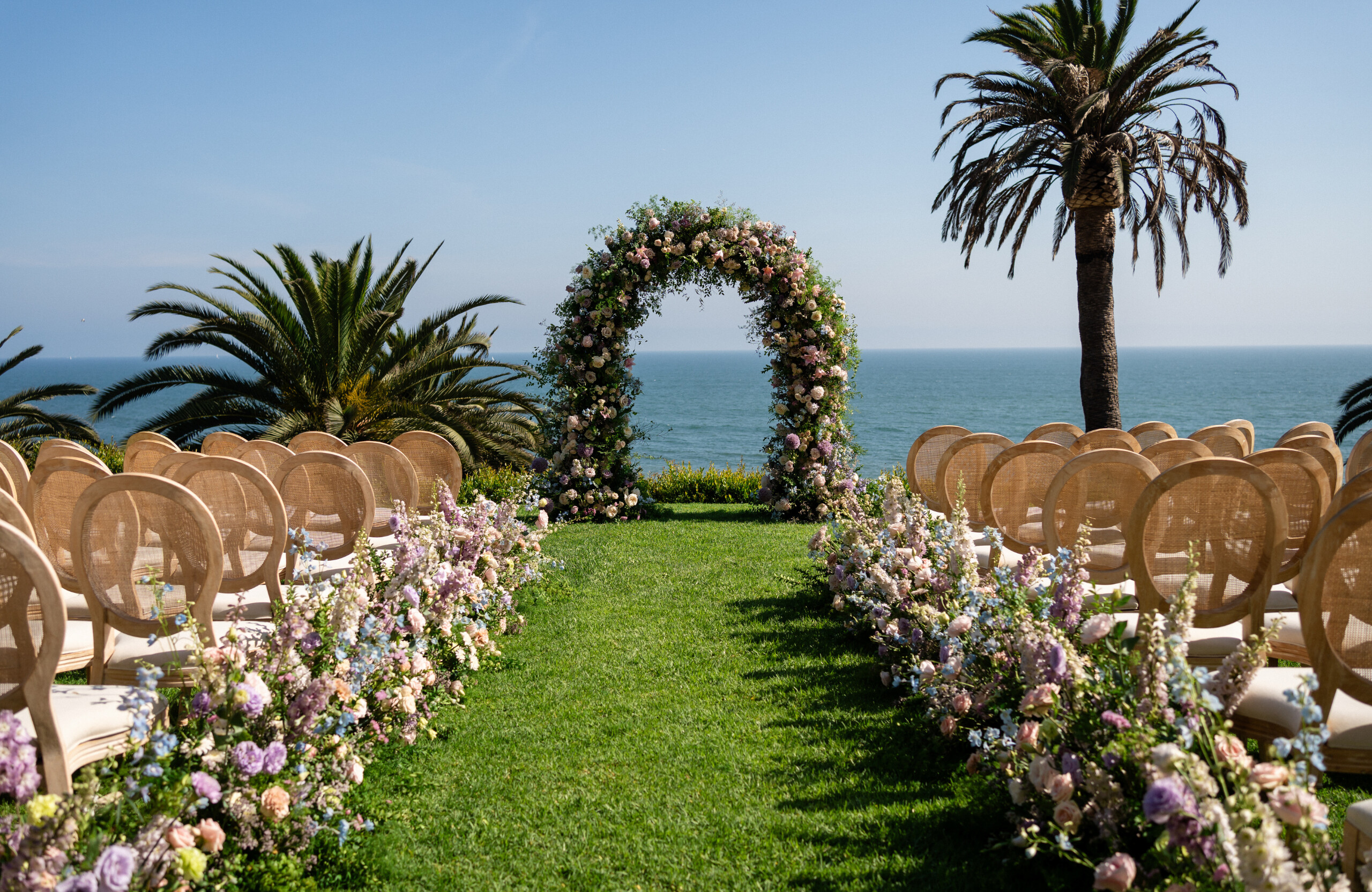 outdoor wedding ceremony at The Bel-Air Bay Club with pastel florals