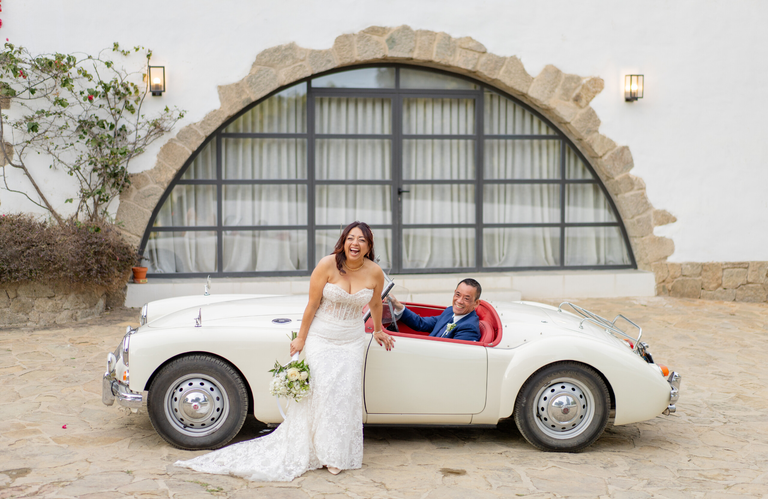 bride and groom with classic car