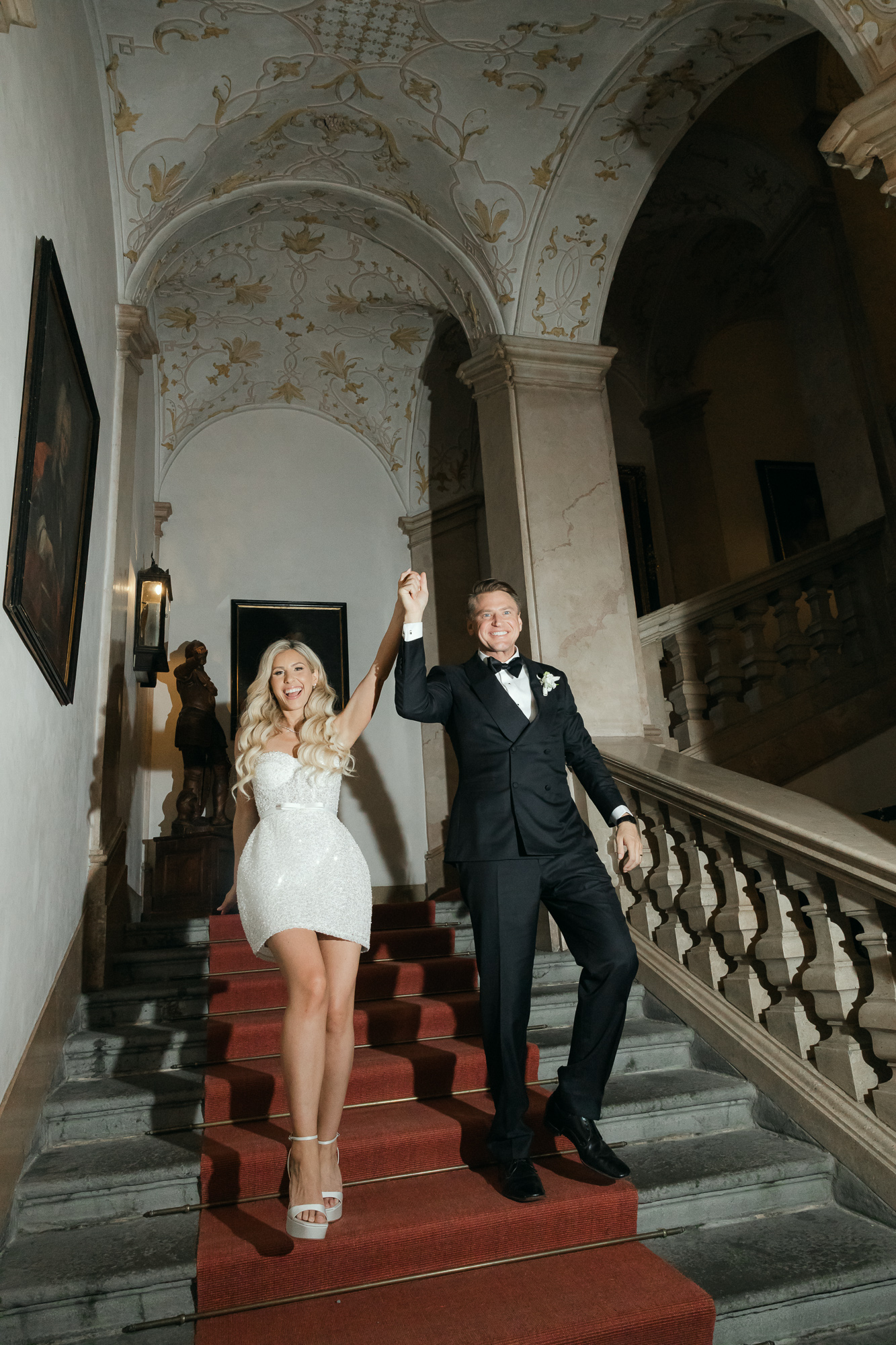 bride and groom walking down stairs at Schloss Leopoldskron 