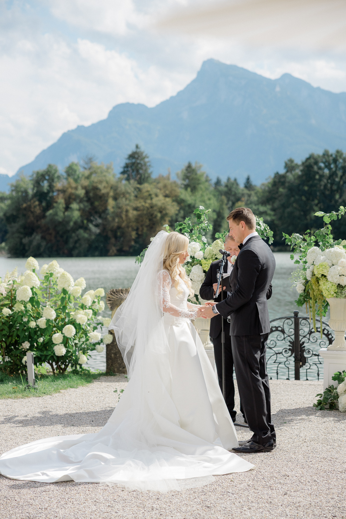 outdoor wedding ceremony by lake at Schloss Leopoldskron 