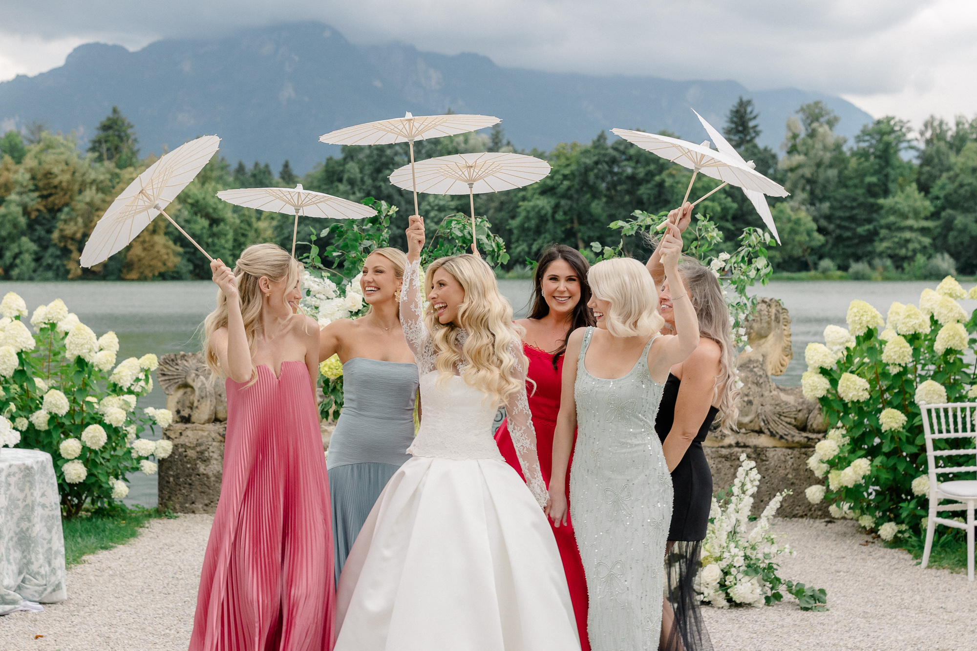 bride and friends with parasols