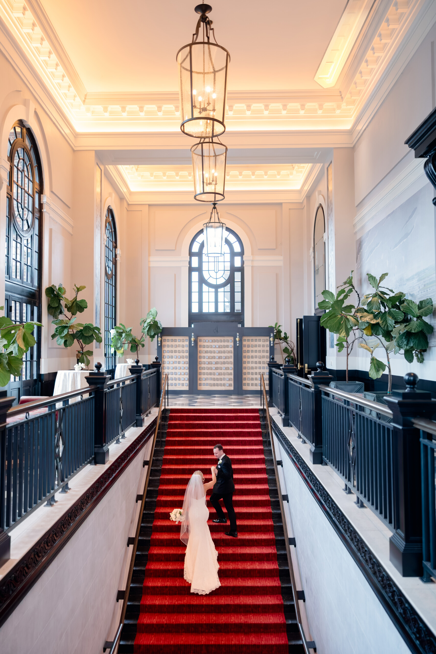 0G4A1728 bride and groom walking up stairs at Pendry Baltimore