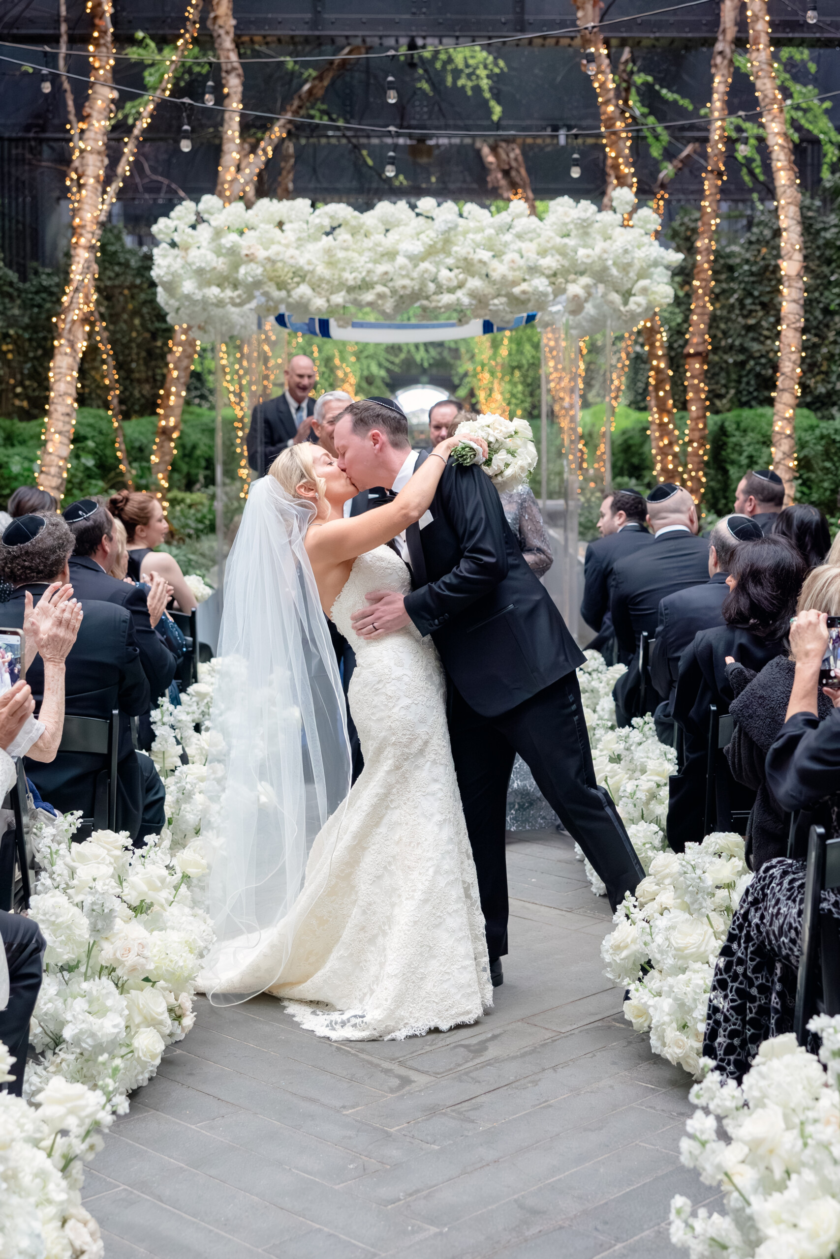 0G4A4607 bride and groom kissing during wedding ceremony
